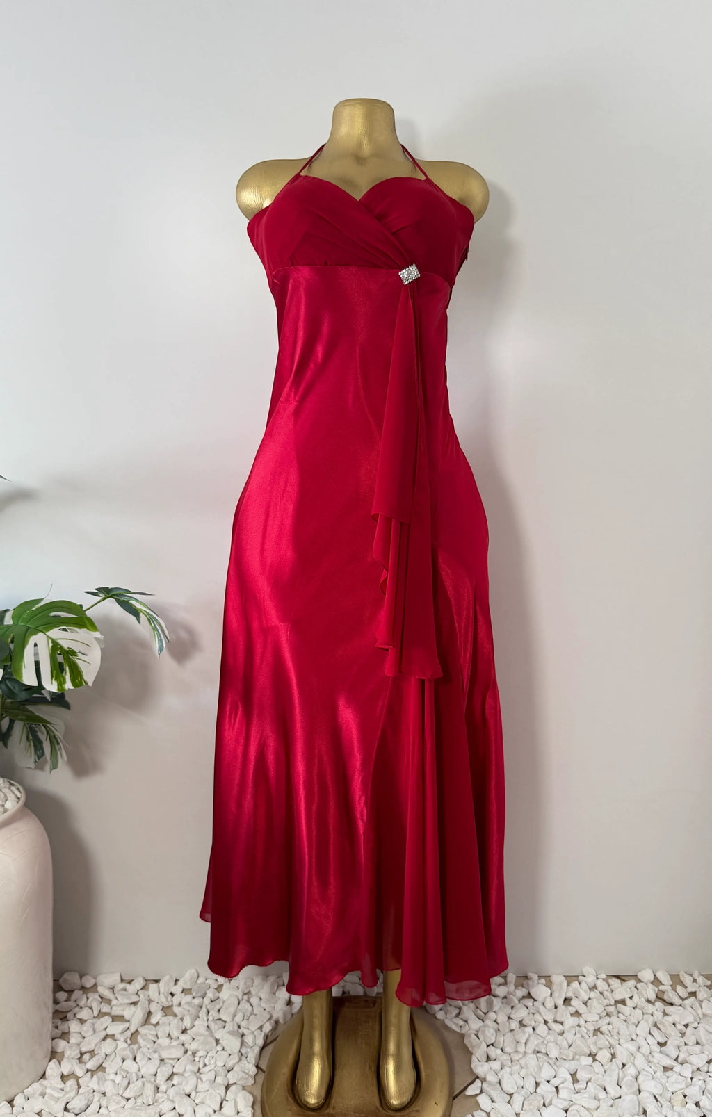 Orvaniwear Betsy & Adam red satin halter gown with ruched sweetheart bodice, rhinestone brooch, and flowing skirt.