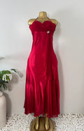 Orvaniwear Betsy & Adam red satin halter gown with ruched sweetheart bodice, rhinestone brooch, and flowing skirt.