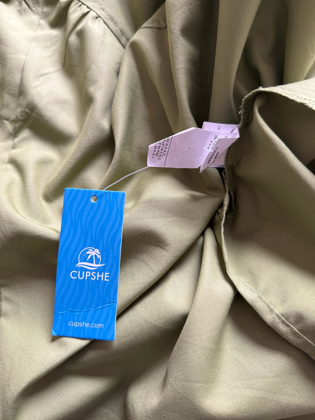 Orvaniwear olive green Cupshe midi dress with brand tag and fabric care label attached