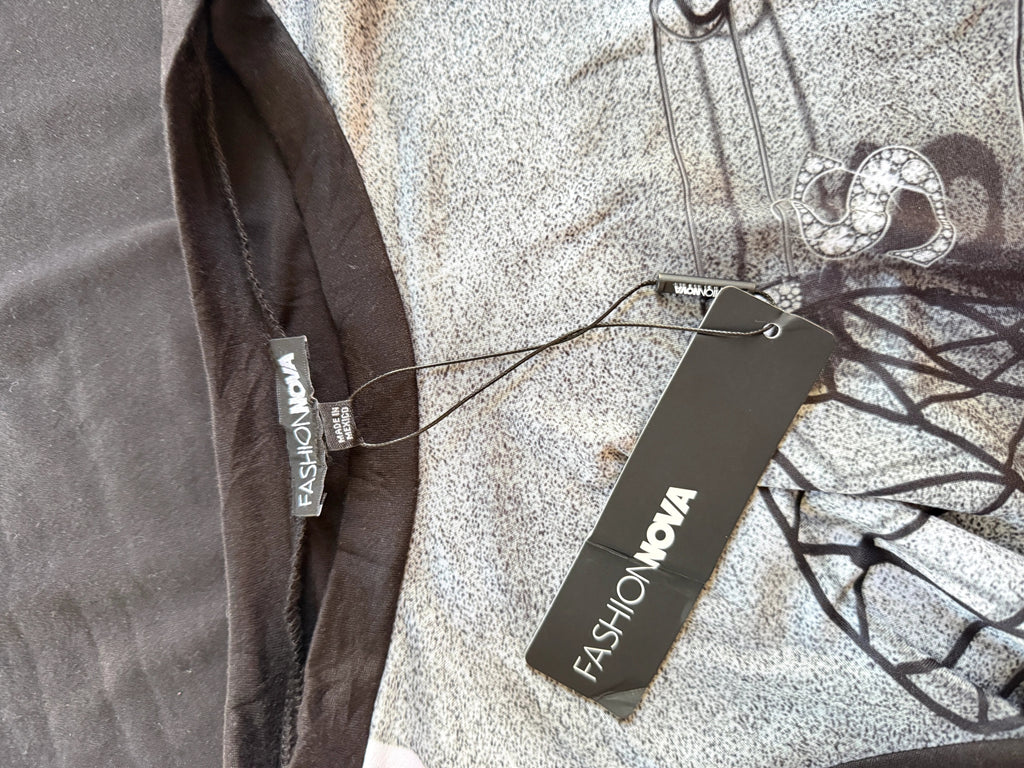 Orvaniwear Fashion Nova maxi dress with grey spiderweb graphic, safety-pin print, and rhinestone detail on black fabric
