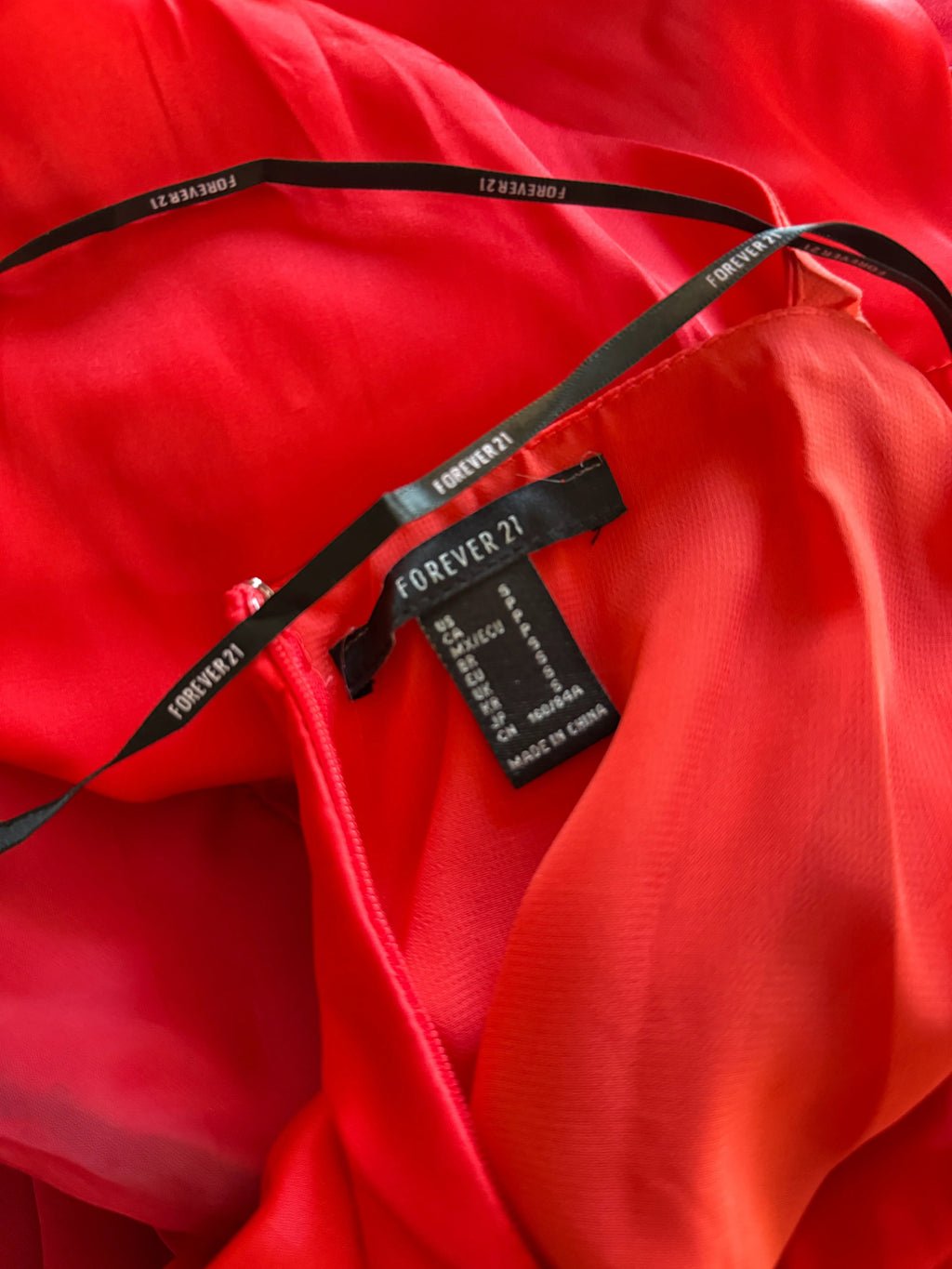 Orvaniwear Forever 21 red maxi dress label detail showing size small and black branded halter straps