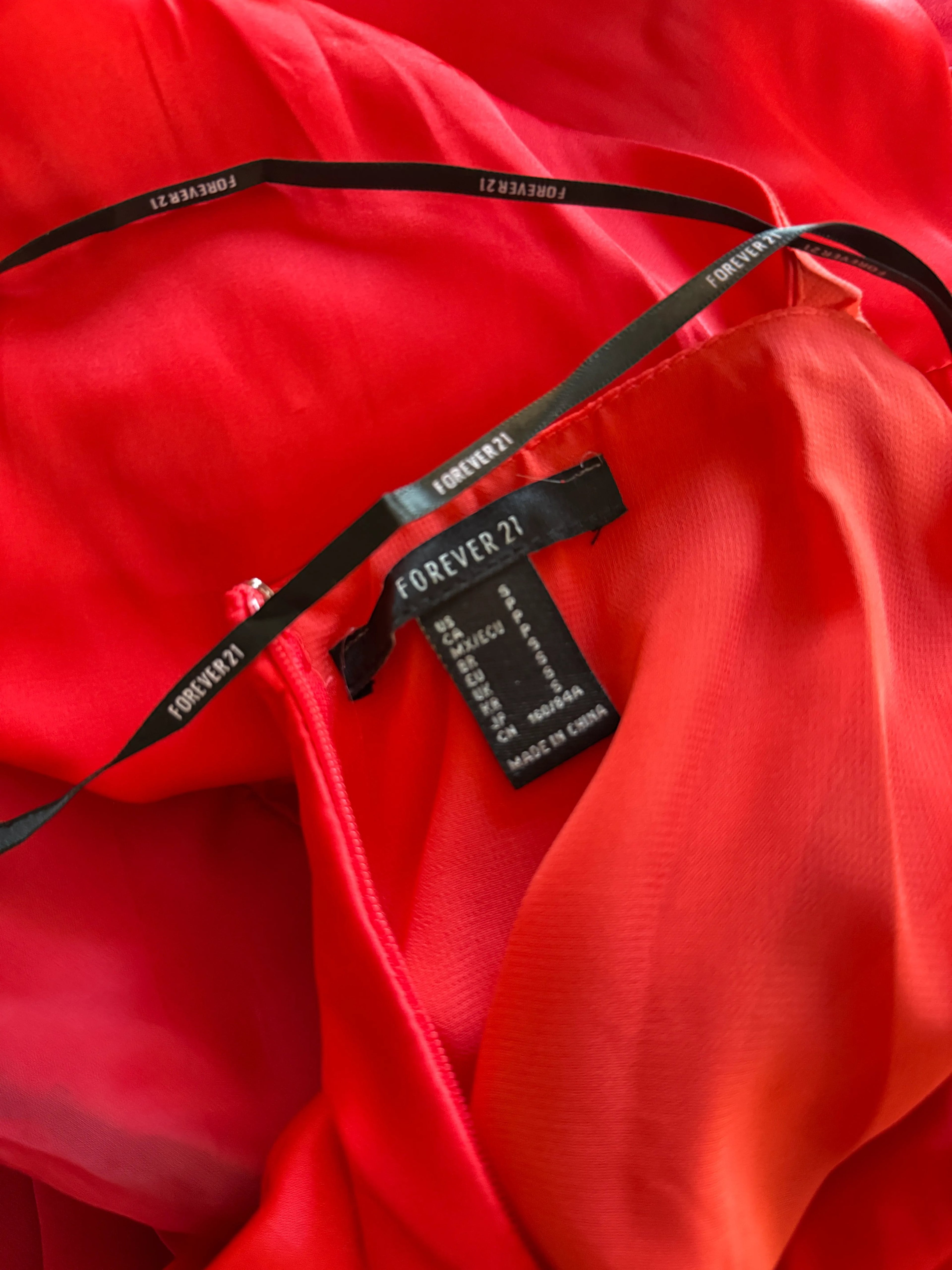 Orvaniwear Forever 21 red maxi dress label detail showing size small and black branded halter straps