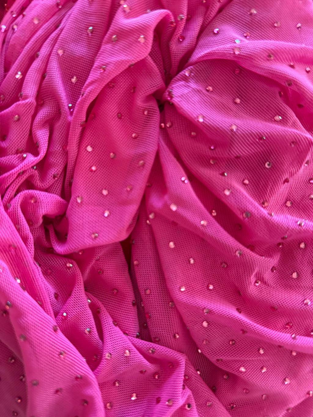 Orvaniwear hot pink mesh bodycon dress featuring scattered rhinestone embellishments and ruched fabric texture.