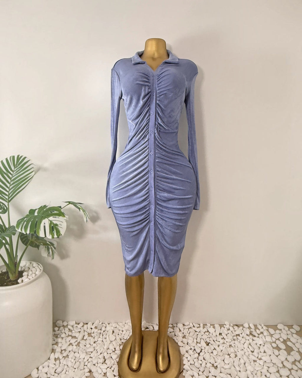 Orvaniwear lilac velour midi dress with long sleeves, collared button-front, and ruched center detail on a mannequin.