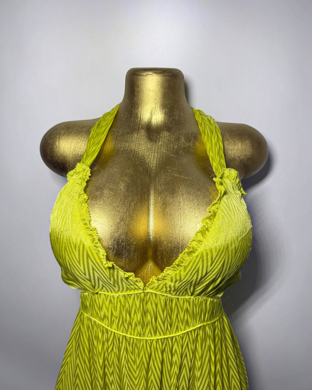 Orvaniwear Zara lime green satin midi dress with a plunging halter neckline and textured chevron pattern