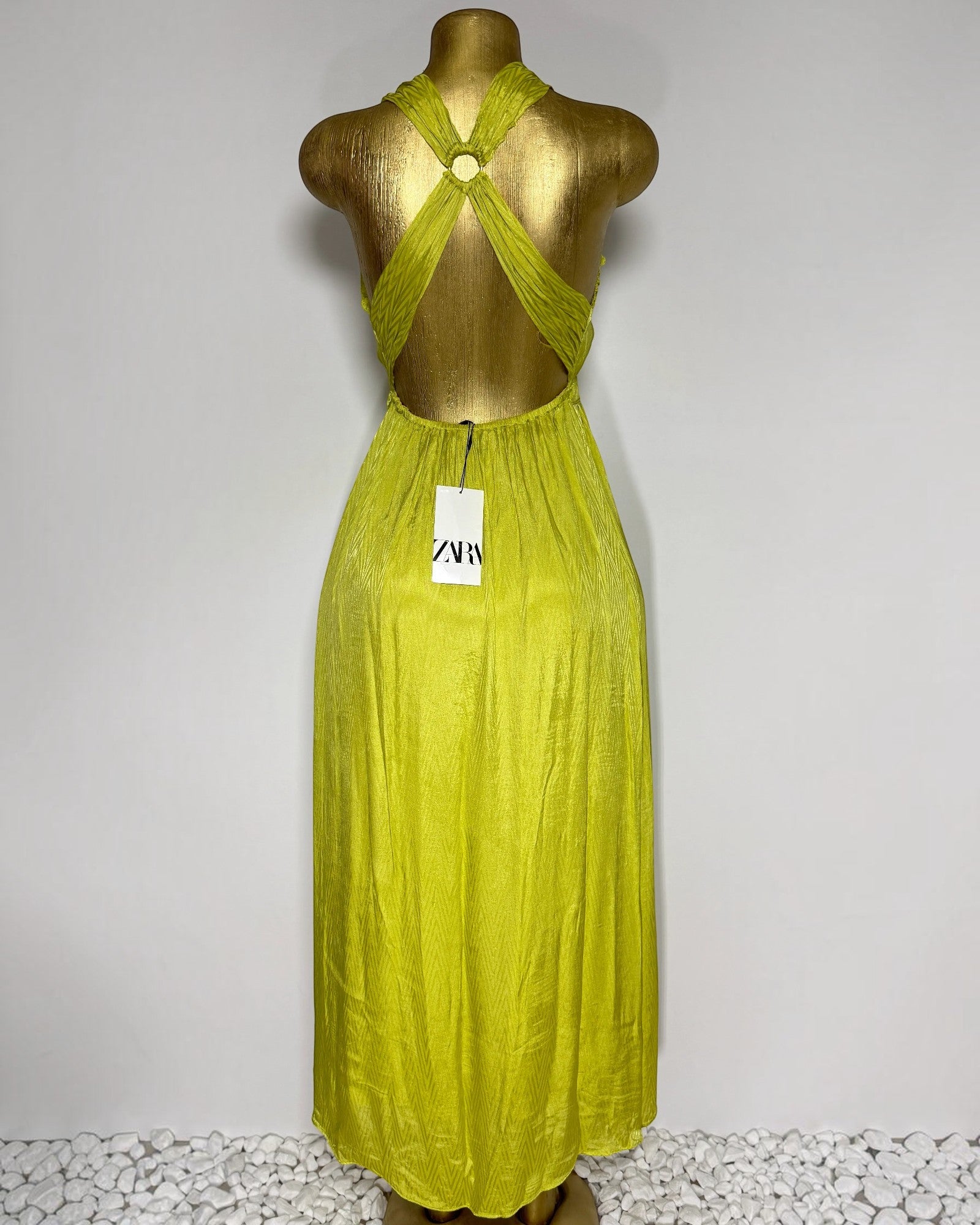 Orvaniwear lime green satin midi dress with a halter neckline and crisscross open back featuring a ring detail.
