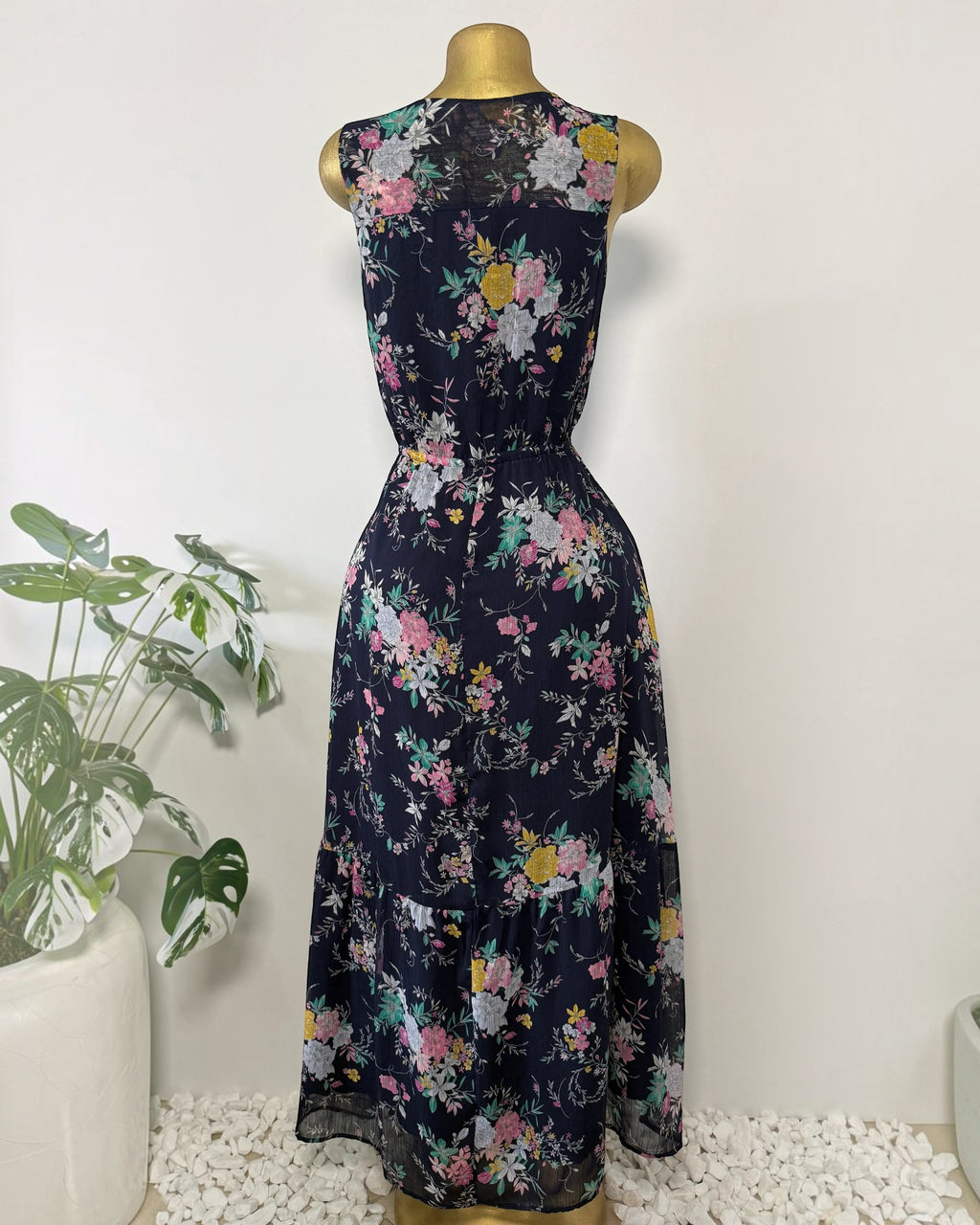 Orvaniwear Merona navy midi dress with colorful floral print, sleeveless V-neck design, and tiered ruffle hem.