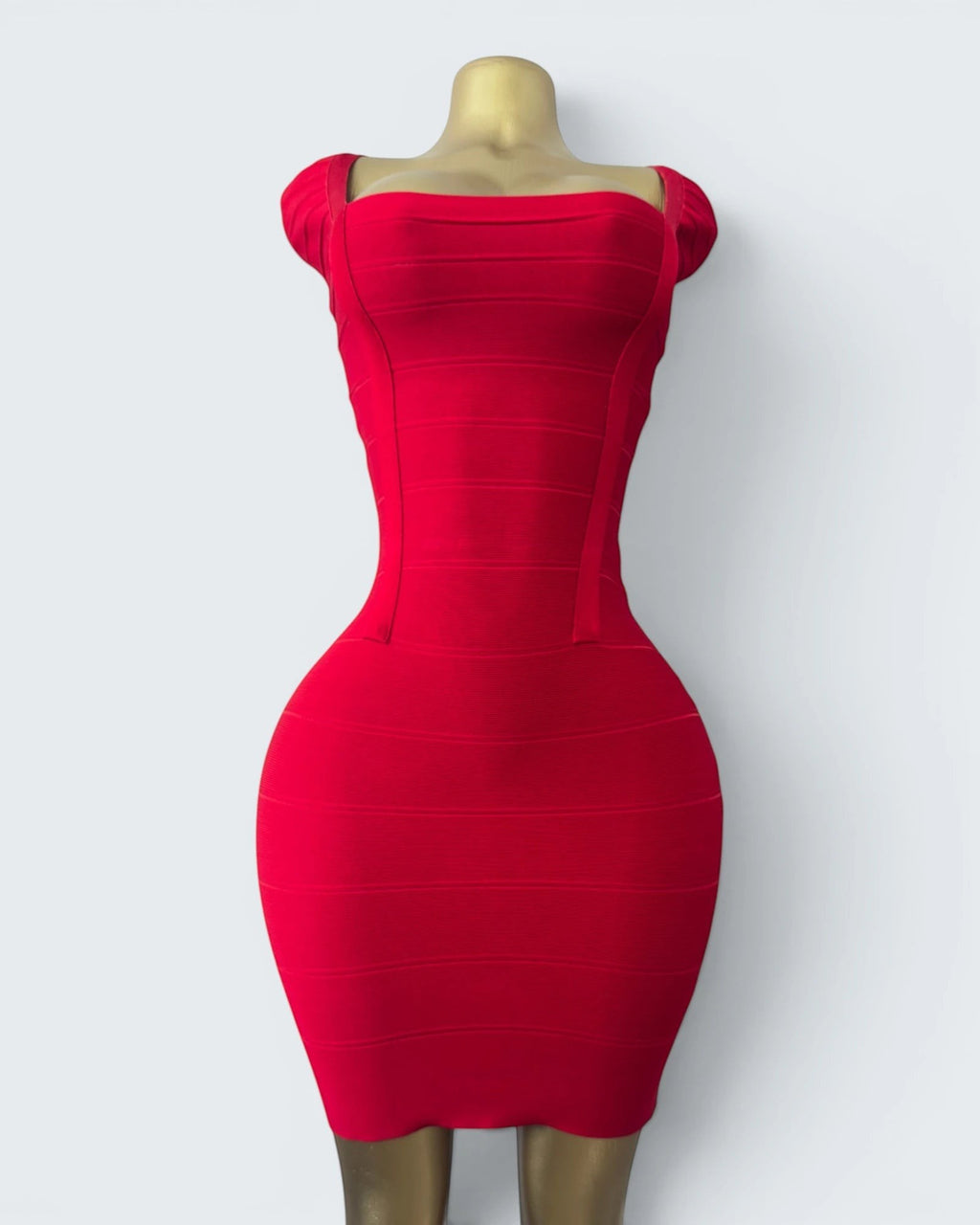 Orvaniwear BCBG Max Azria red bandage bodycon dress with a square neckline and sculpting stretch fit on a mannequin.