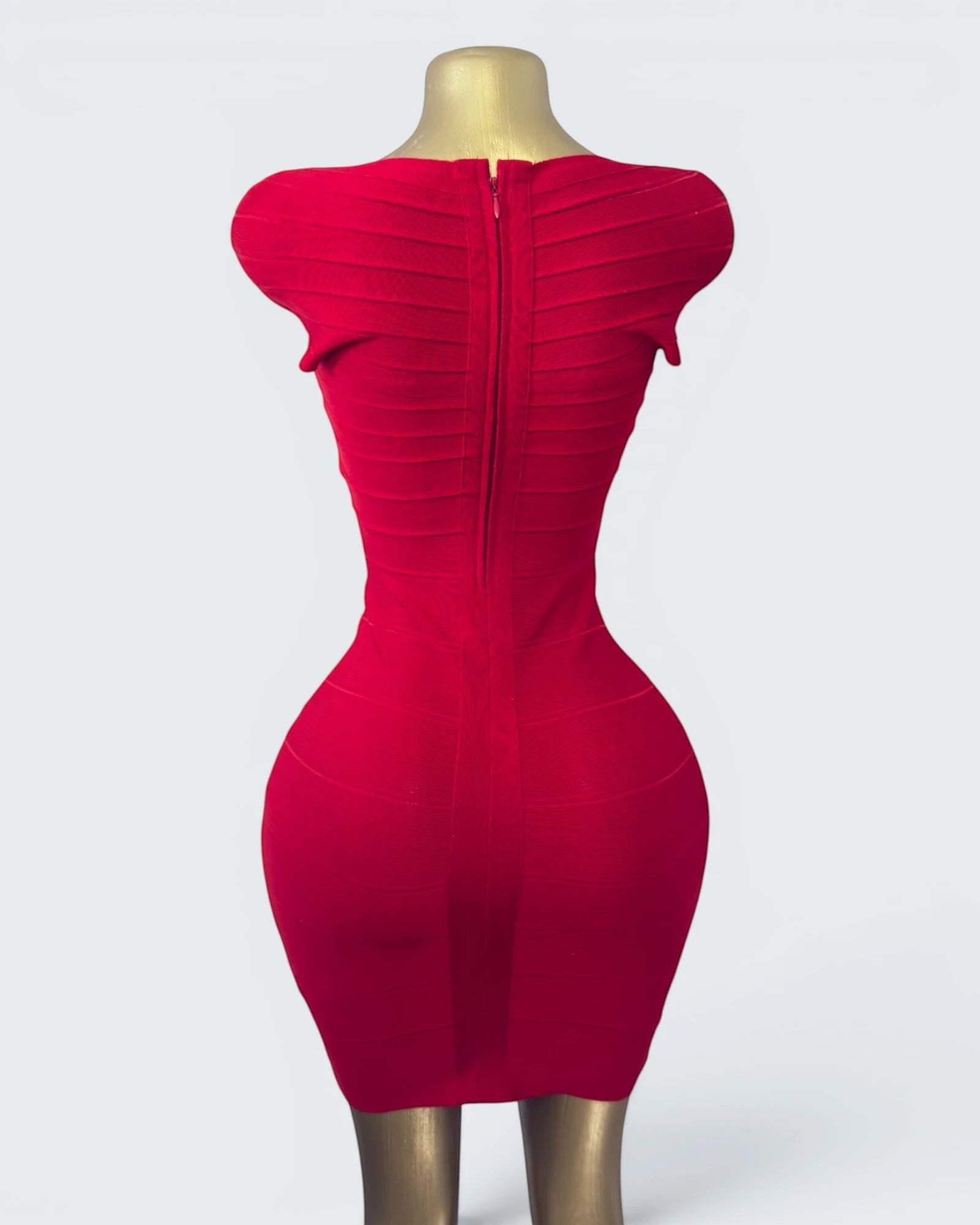 Orvaniwear BCBG Max Azria red bandage bodycon dress with a back zipper, shown on a mannequin