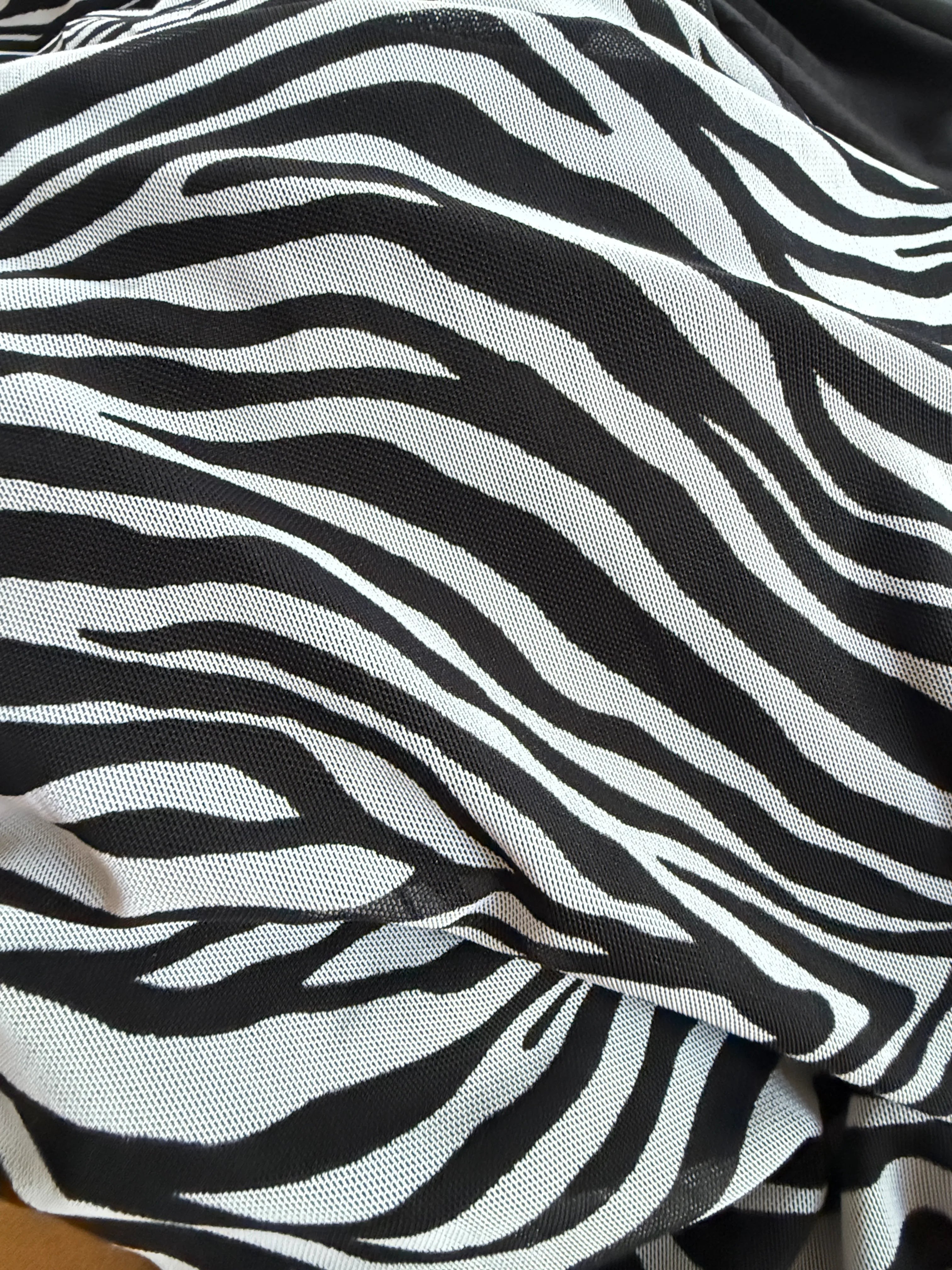 Orvaniwear black and white zebra print mesh fabric detail from a Princess Polly bodycon maxi dress