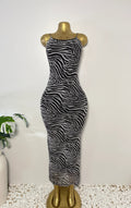 Orvaniwear Princess Polly black and white zebra print mesh bodycon maxi dress with thin straps on a gold mannequin.
